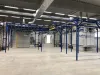 Coating line with overhead conveyor