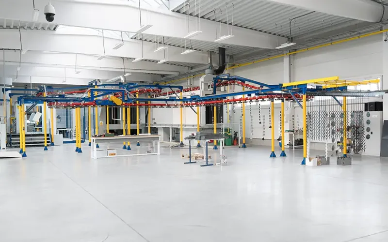 Powder coating line in an industrial facility