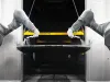 Robots coating a freight wagon