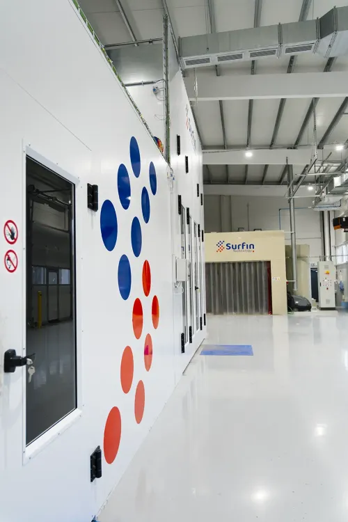 Wet coating line with red and blue SURFIN Technology logo