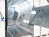 Wet coating booth with coated metal parts