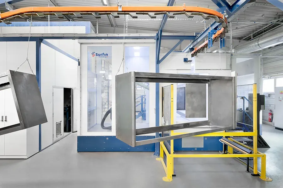 Metal parts on an overhead conveyor