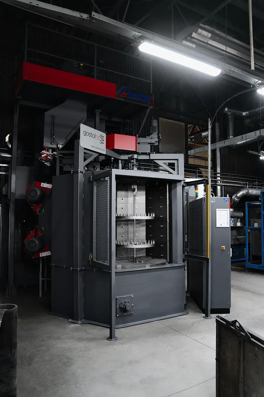 Blasting machine with dual blasting wheels