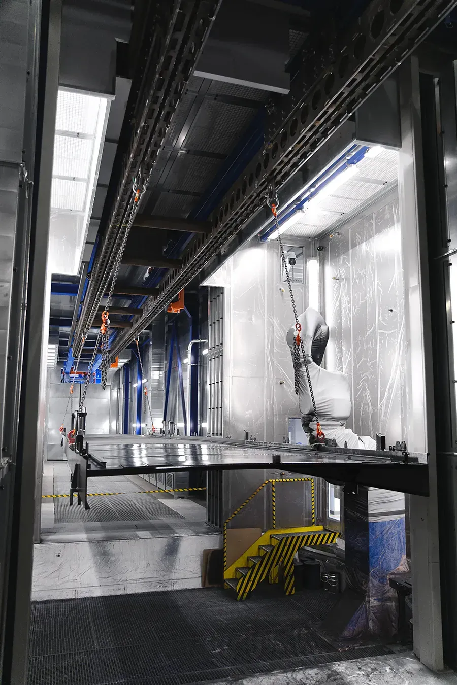 Freight wagon moving through coating booth