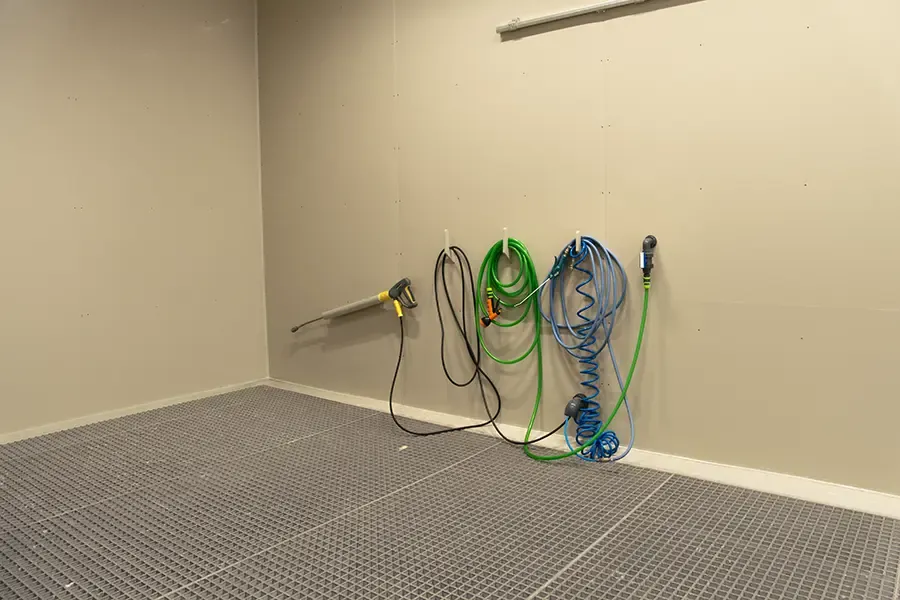 Washing equipment inside industrial wash booth
