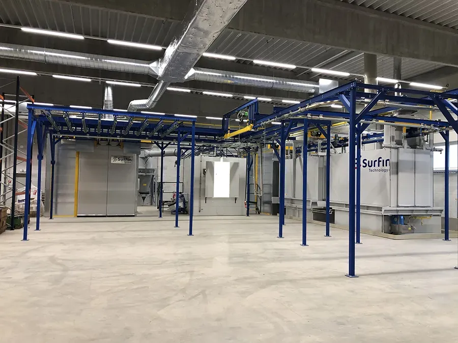 Coating line with overhead conveyor