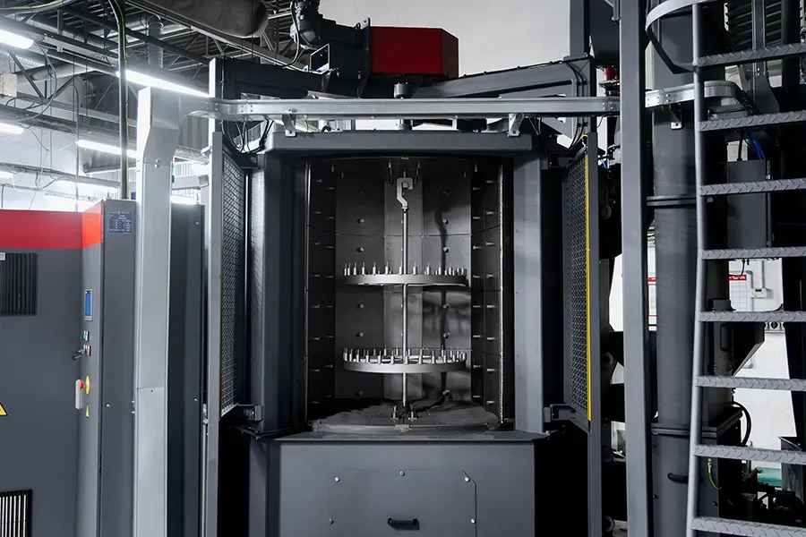 Blasting machine loading station