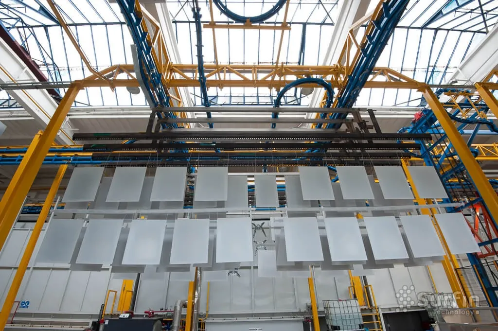 Parts hanging on conveyor