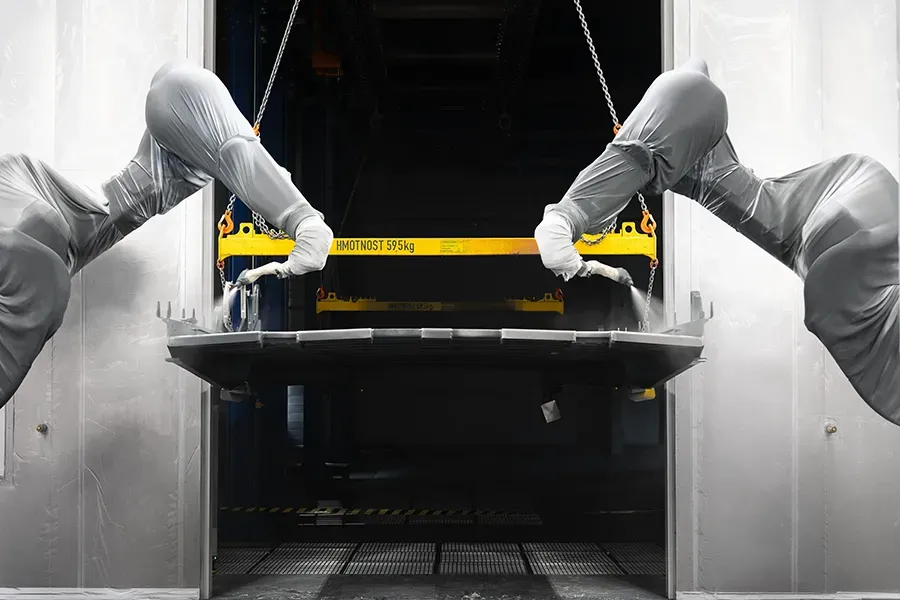 Robots coating a freight wagon