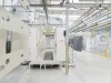 Manual coating booth with part in foreground