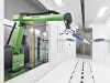 Green robotic arm in a coating booth