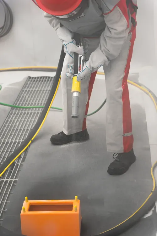 Operator blasting metal part