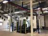 Robotic coating station with an overhead conveyor