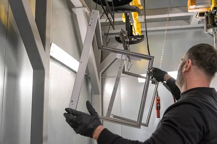 Metal parts being cleaned with pressurised air